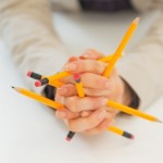 Closeup on business woman holding pencils